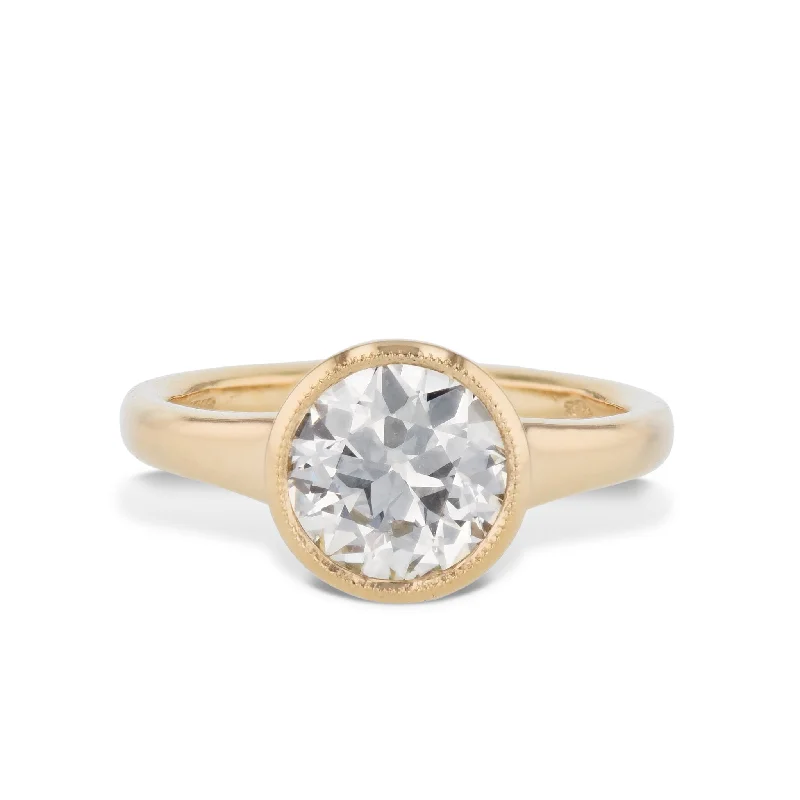 Sparkling Gemstone Rings For Fashion-Forward Looks-Round Bezel Diamond Yellow Gold Engagement Ring